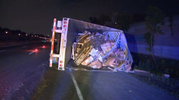 Tractor trailer rollover on QEW