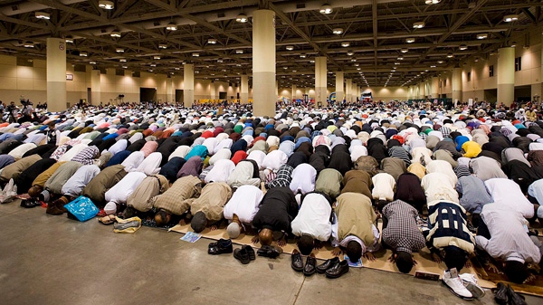 Muslims pray at the Muslim Association of Canada's Eid celebration that marks the end of the holiday of Ramadan at the Metro Convention Centre in Toronto on Tuesday, August 30, 2011. (THE CANADIAN PRESS/Aaron Vincent Elkaim)
