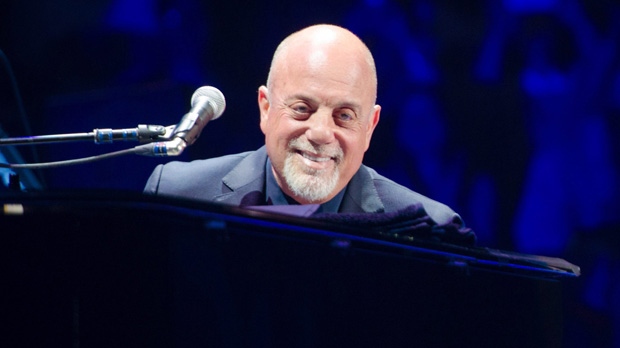 FILE - In this May 9, 2014 file photo, Billy Joel performs at Madison Square Garden in New York. Joel has sold his beachfront mansion on Long Island according to the listing agent, Nancy Mizrahi of Saunders & Associates. Sagaponack is a village in the Town of Southampton in Suffolk County. In 2009, it was listed as the most expensive small village in the U.S.(Photo by Scott Roth/Invision/AP, File)