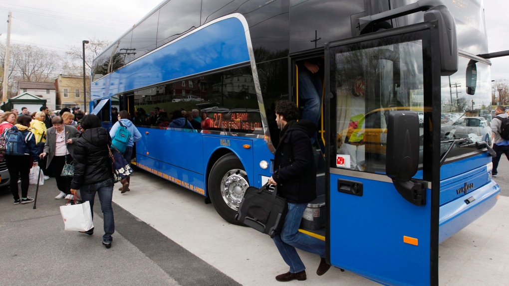 In this file photo, passengers get off a Megabus bus at a Station in Rensselaer, N.Y., on Monday, April 9, 2012. (AP /Mike Groll)