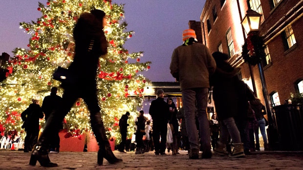 Shoppers take in the sights at the Toronto Christmas Market in The Distillery Historic District on Thursday Dec. 18, 2014. The market runs until Sunday Dec. 21, 2014. THE CANADIAN PRESS/Frank Gunn