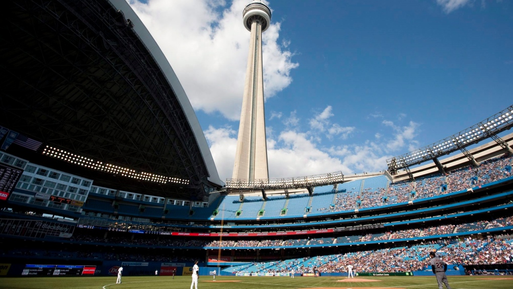 The CN Tower looms over the Toronto Blue Jays and Detroit Tigers in Toronto, Saturday, May 7, 2011. THE CANADIAN PRESS/Darren Calabrese