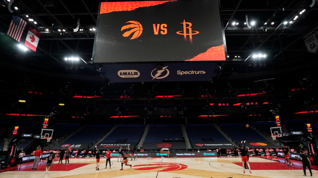 Some members of the Toronto Raptors and Houston Rockets take part in a shoot around before an NBA basketball game Friday, Feb. 26, 2021, in Tampa, Fla. (AP Photo/Chris O'Meara)