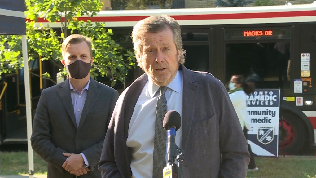Mayor John Tory is shown outside a mobile vaccination clinic in East York on Thursday.