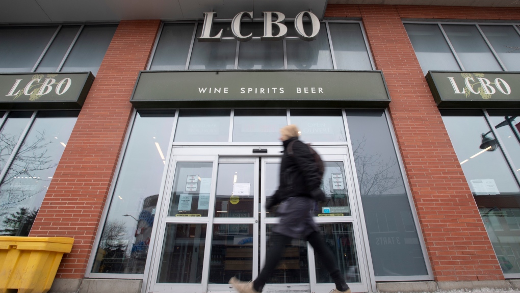 A person walks past an LCBO location on Thursday March 19, 2020. THE CANADIAN PRESS/Adrian Wyld