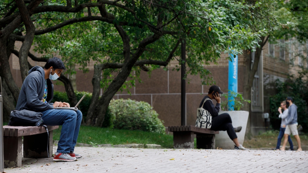 People are seen lounging on Ryerson University campus in Toronto, Tuesday, Sept. 8, 2020. THE CANADIAN PRESS/Cole Burston
