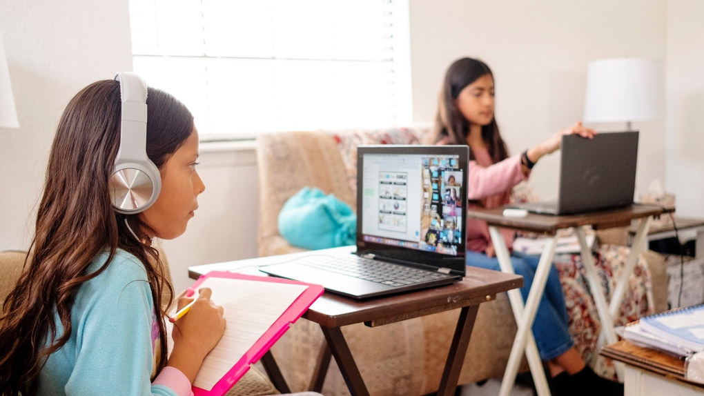 A child participates in virtual learning at home.