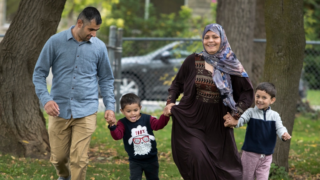 Parwaiz Hamidy, Rahima Hamidy and their children Anam, four, (right) and Hasam, three, are shown in Peterborough, Ont. on Friday, October 15, 2021. The tiring and terrifying journey of the Hamidy family from their rural town in Afghanistan's Parwan province to Peterborough, Ont. has a happy ending. THE CANADIAN PRESS/Fred Thornhill 