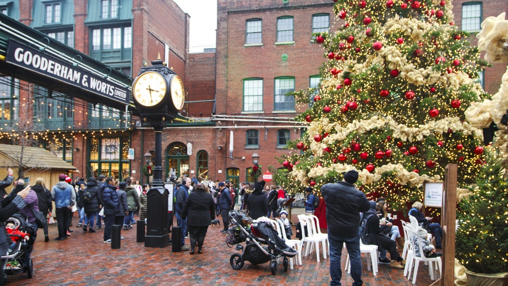 People visit Christmas market in Distillery Historic District, one of the Toronto's favourite holiday traditions (Anjelagr | Dreamstime)