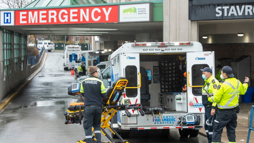 Paramedics and ambulances spill out of the Emergency ramp at Michael Garron Hospital in Toronto on Monday, April 12, 2021. THE CANADIAN PRESS/Frank Gunn
