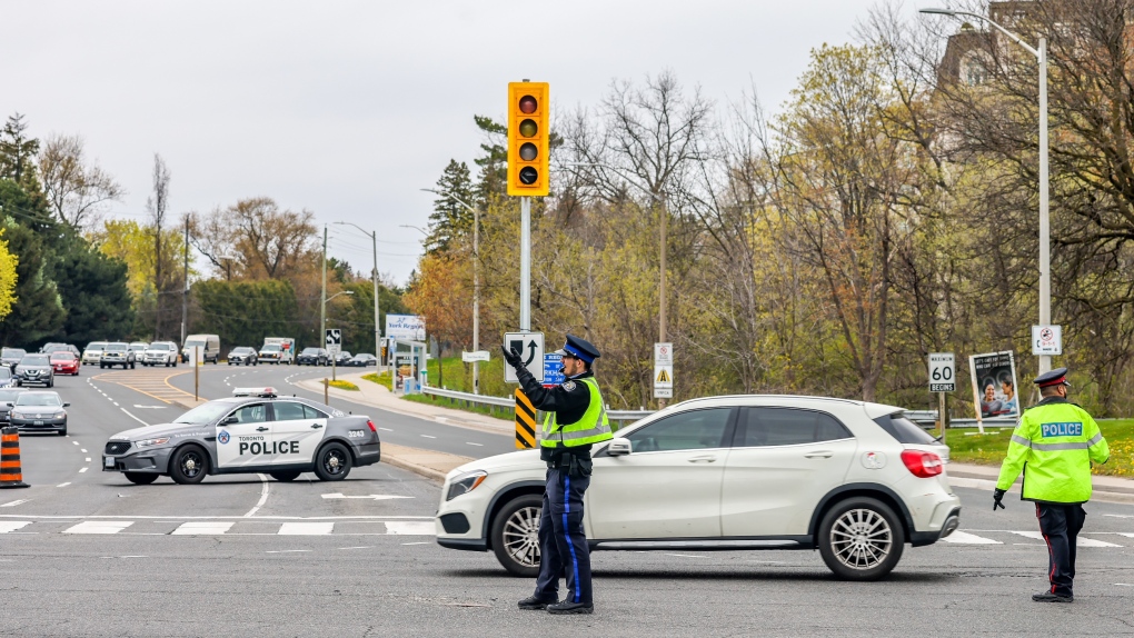 Officers help direct traffic amid a power outage in North York on May 3, 2021. (Tom Podolec/CTV News Toronto)