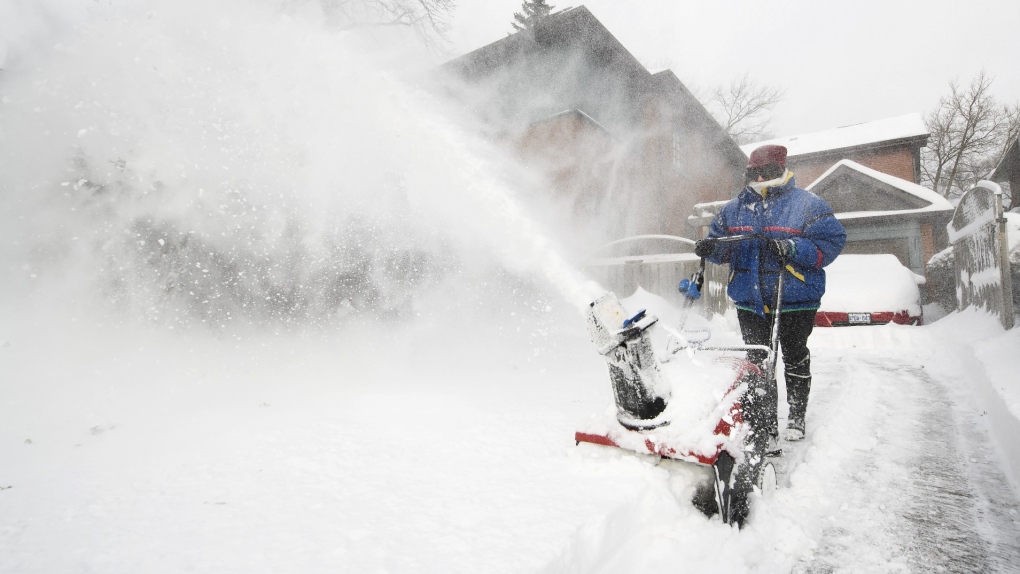 An Ontario resident shovels snow. (The Canadian Press)