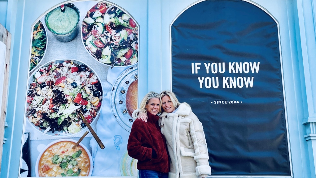 Mandy and Rebecca Wolfe stand outside of their first Mandy's Salads location in Toronto, located at 52 Ossington Avenue (Supplied). 