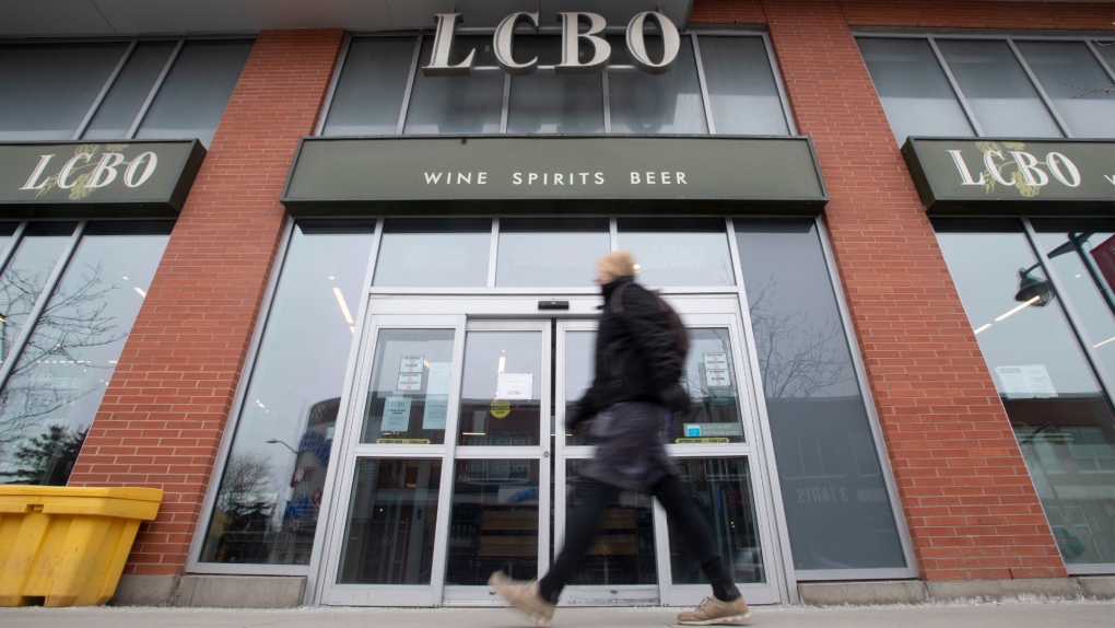 A person walks past an LCBO in Ottawa, Thursday March 19, 2020. THE CANADIAN PRESS/Adrian Wyld