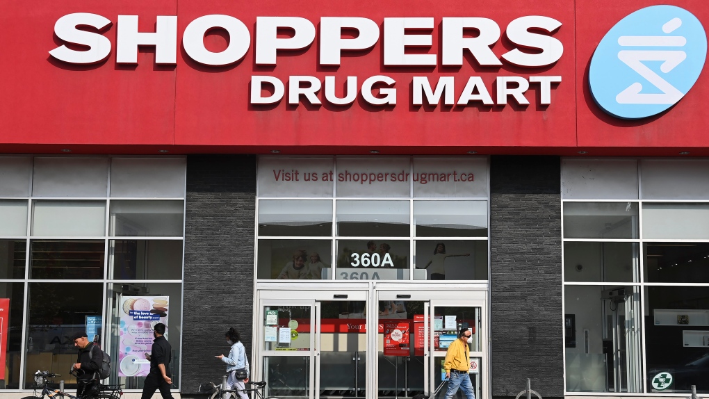 People leave a Shoppers Drug Mart where they are providing COVID-19 testing by appointment only during the COVID-19 pandemic in Toronto on Friday, September 25, 2020. THE CANADIAN PRESS/Nathan Denette