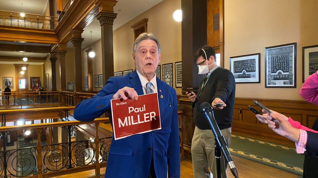Paul Miller, an ousted member of the Ontario New Democrats, shows his Independent campaign sign at Queen's Park in Toronto on Wednesday March 23, 2022. Miller says he was kicked out of caucus for a Facebook post he claims he did not write. THE CANADIAN PRESS/Holly McKenzie-Sutter