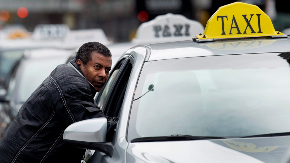 A taxi driver protests Uber in Toronto on Monday, June 1, 2015. THE CANADIAN PRESS/Nathan Denette