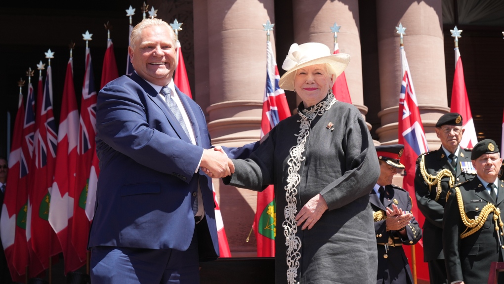 Premier Doug Ford shakes hands with Lieutenant-Governor of Ontario Elizabeth Dowdeswell prior to the announcement of his new cabinet at the swearing-in ceremony at Queen’s Park in Toronto on June 24, 2022. THE CANADIAN PRESS/Nathan Denette