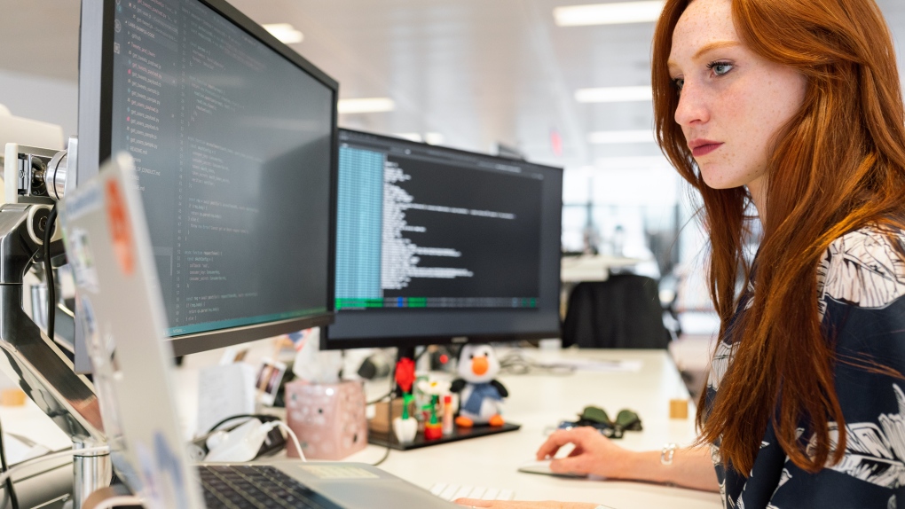A woman can be seen working at a desk in the file photo above. (ThisIsEngineering/Pexels)
