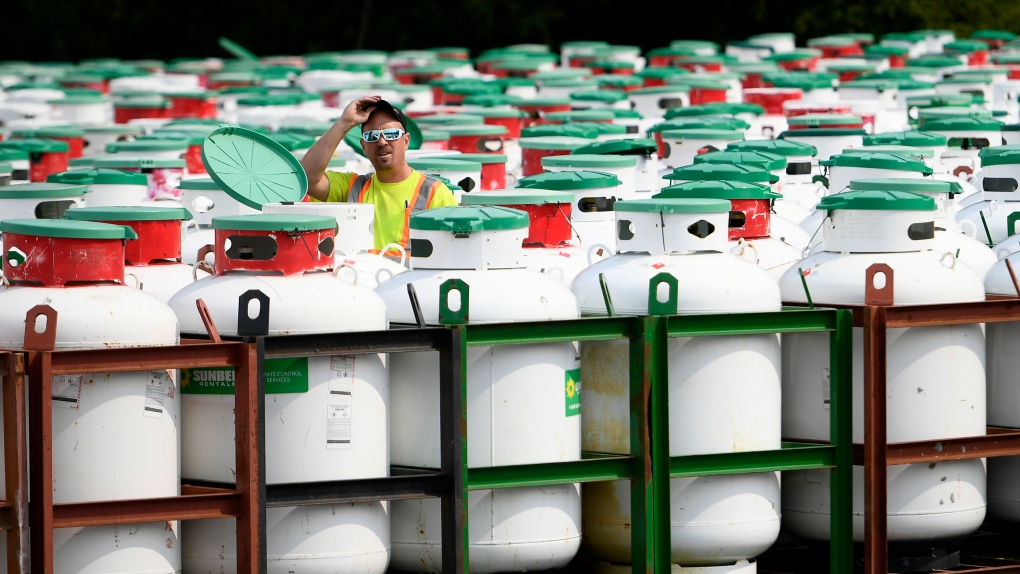 A technician walks among propane tanks at Sunbelt Rentals in Ottawa, on Tuesday, Sept. 15, 2020. THE CANADIAN PRESS/Justin Tang