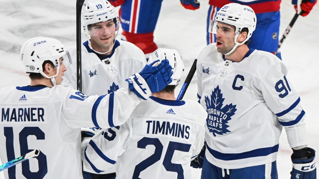 Toronto Maple Leafs Calle Jarnkrok (19) celebrates with teammates (left to right) Mitch Marner, Conor Timmins and John Tavares after scoring against the Montreal Canadiens during first period NHL hockey action in Montreal, Saturday, January 21, 2023. THE CANADIAN PRESS/Graham Hughes