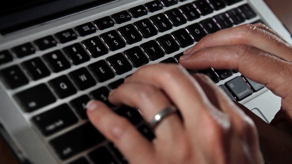 A person types on a laptop in a file photo. THE CANADIAN PRESS/AP, /Elise Amendola
