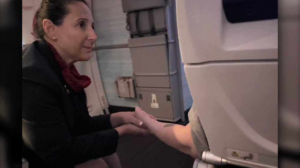 An Air Canada flight attendant is being recognized for spending hours helping a passenger having a panic attack. (Supplied: Emerson Leander)