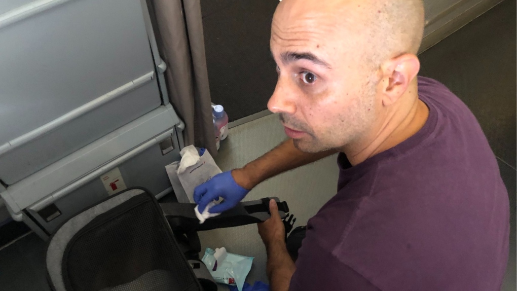 Air France passenger Habib Battah cleaning onboard the Toronto-bound flight. (Twitter/@habib_b)