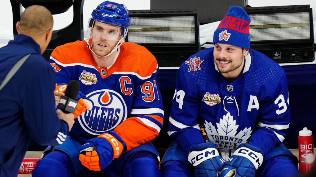 Edmonton Oilers' Connor McDavid sits with Toronto Maple Leafs' Auston Matthews during the during the NHL All-Star skills competition in Toronto, Friday, Feb. 2, 2024. (The Canadian Press/Frank Gunn)