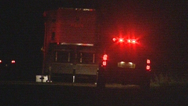 Police officials search for a missing toddler at a Six Nations Reserve near Brantford, Ont. on Sunday, Oct. 16, 2011.