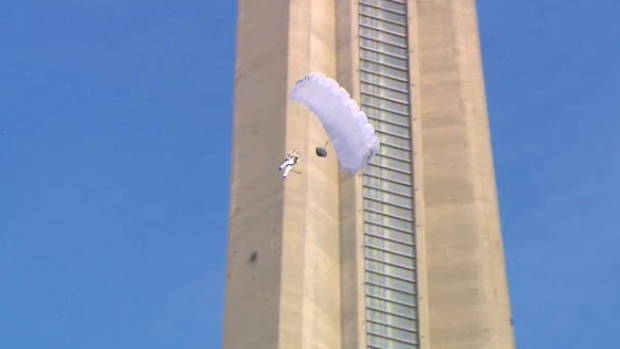 Person with parachute jumps from CN Tower