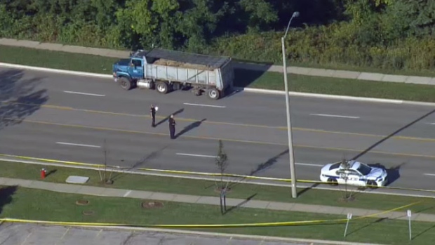 Dump truck tire strikes pedestrian